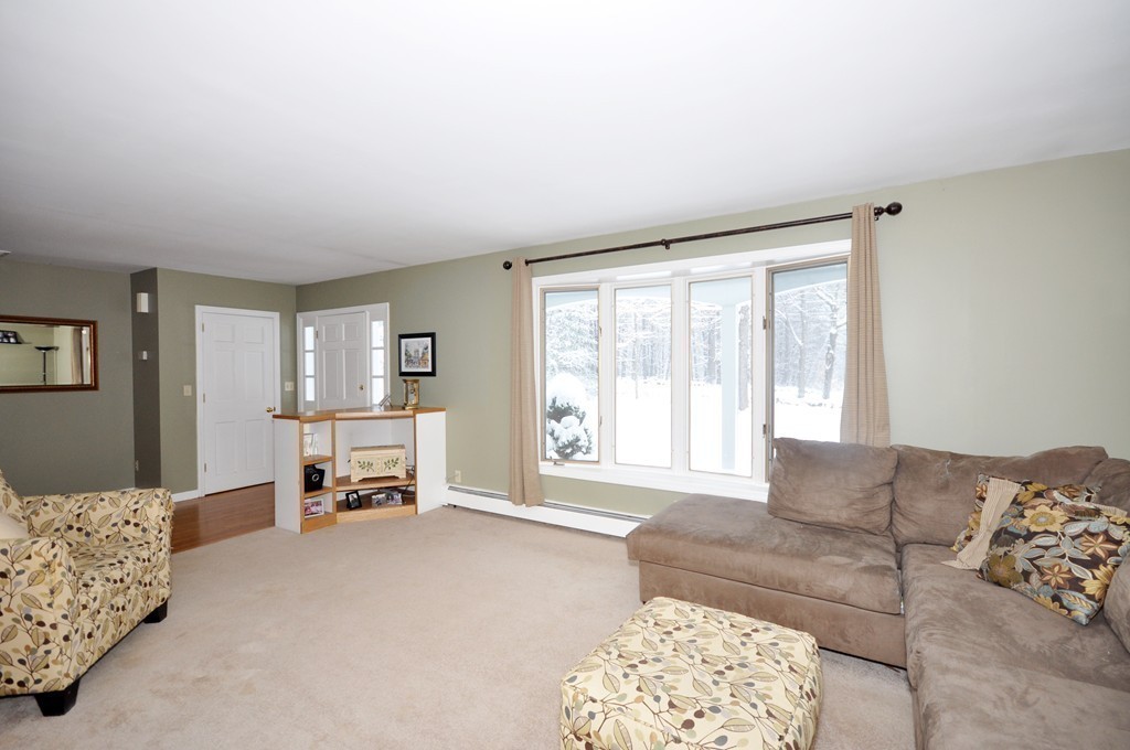 33 Warner Road Bolton, MA 01740 - Photo 7 of 23 a living room with furniture and a large window