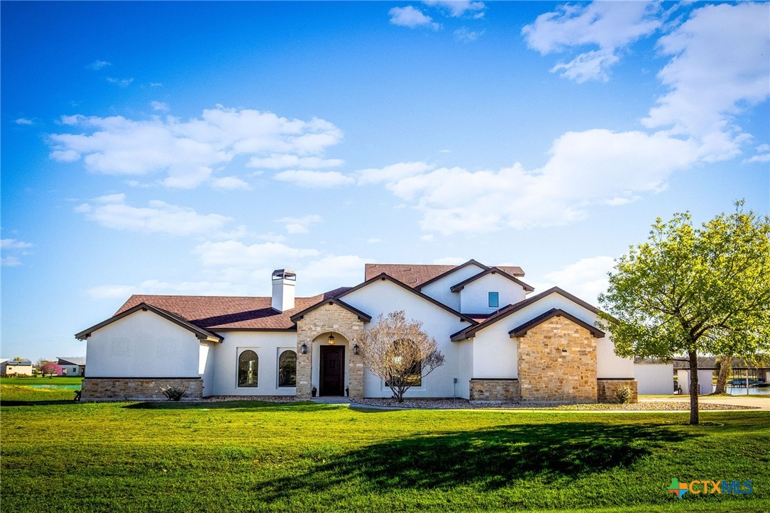925 River Ranch Circle Martindale, TX 78655 - Photo 4 of 48 a front view of a house with a yard