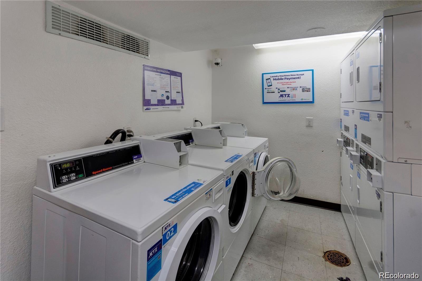 1300 South Parker Road, Unit 110 Denver, CO 80231 - Photo 4 of 5 a utility room with dryer and washer