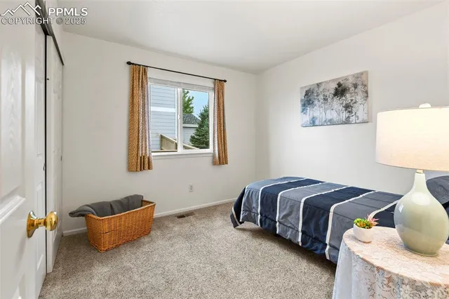 a bedroom with bed and window