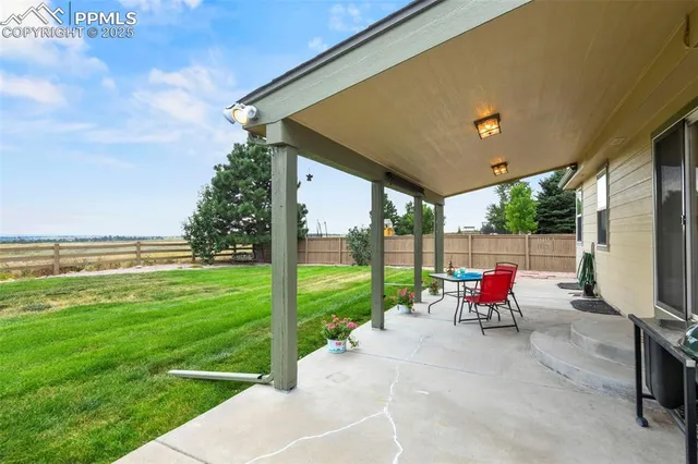 a view of a garden with chairs