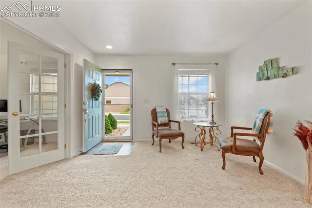 a living room with furniture and a window