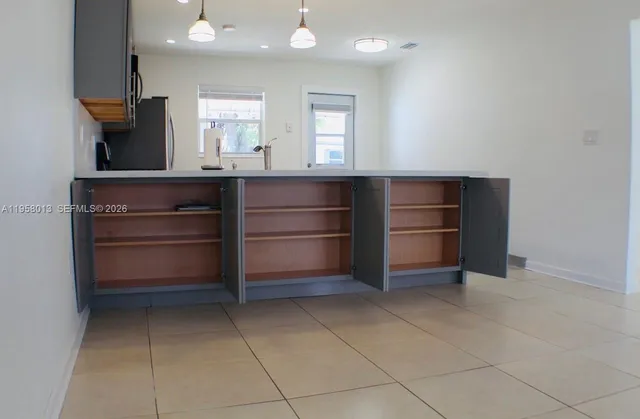 a room with cabinets and window