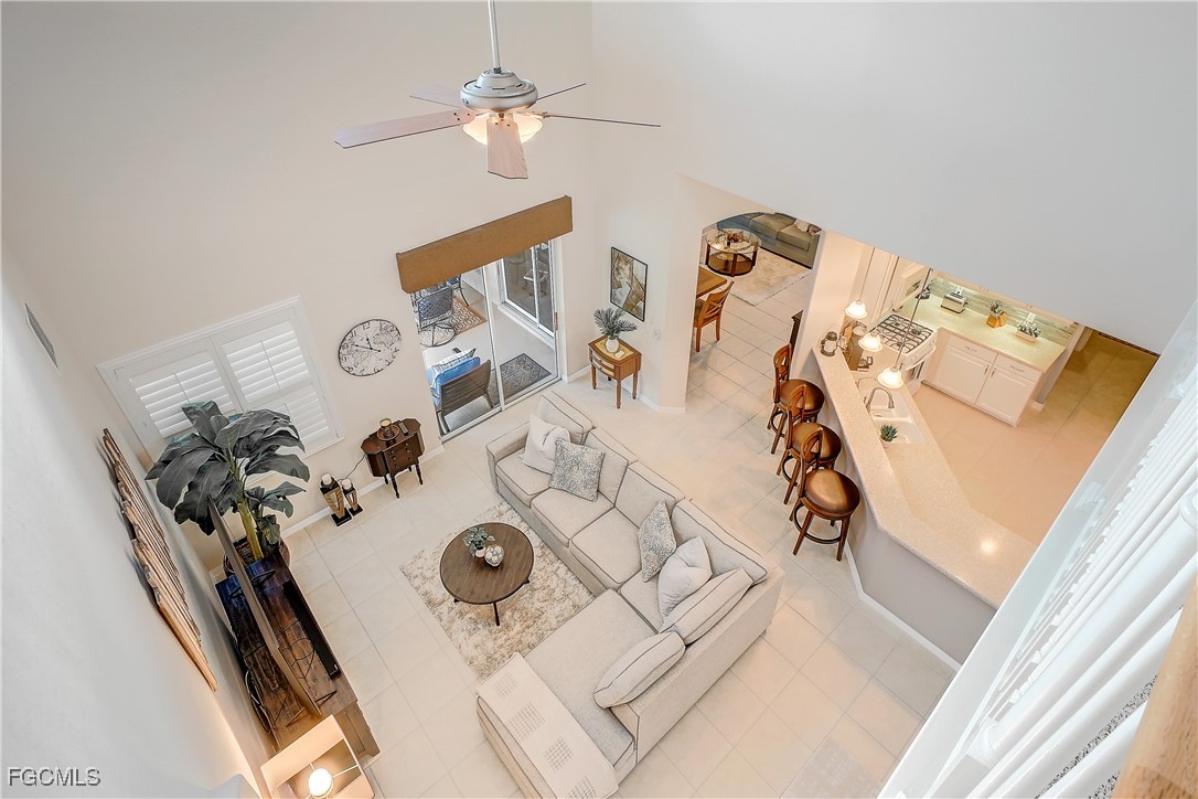 12910 Timber Ridge Drive Fort Myers, FL 33913 - Photo 8 of 37 wooden floor with a vase of flowers sitting on a table