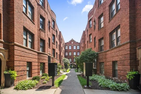 a view of a building with a garden
