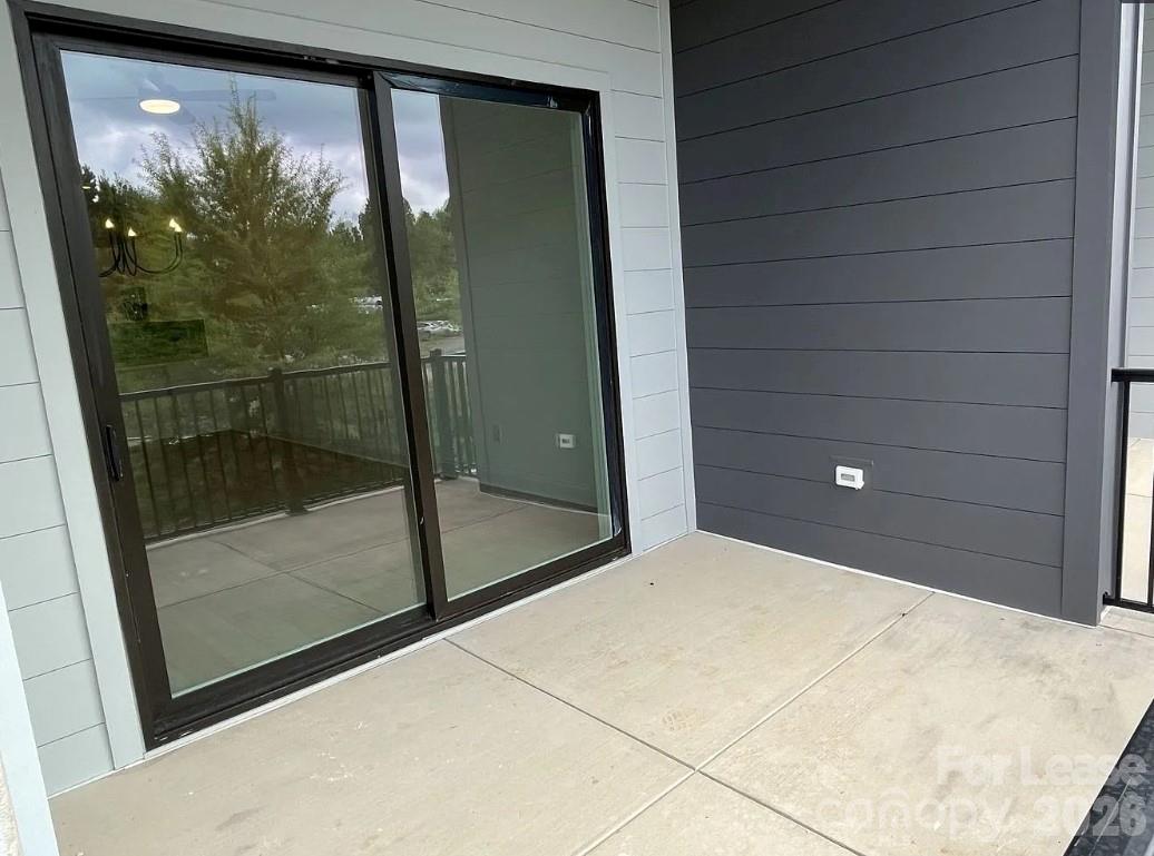 19546 Greentree Way, Unit 203 Cornelius, NC 28031 - Photo 12 of 22 a bathroom with a glass shower door and a window