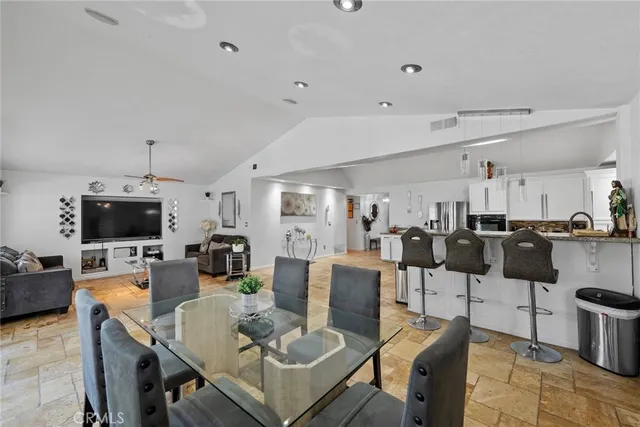 a living room with lots of furniture and a flat screen tv