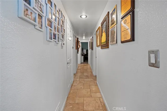 a view of a hallway with staircase
