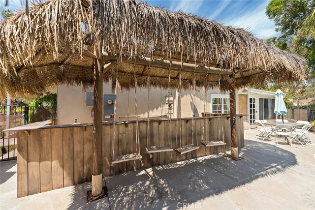 a view of a chair and table in the patio