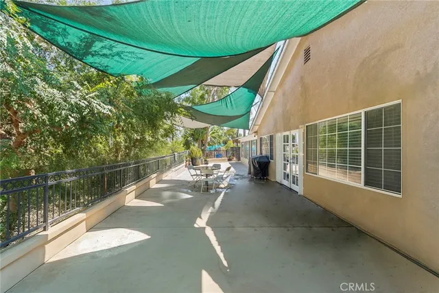 a view of a backyard with a lake view and sitting space