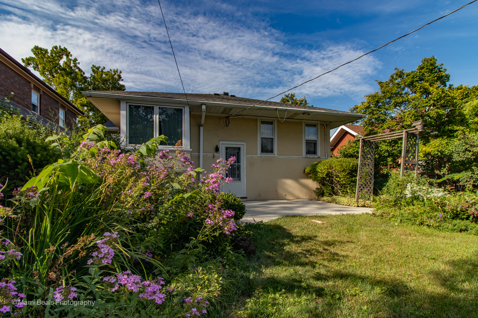 269 Shenstone Road Riverside, IL 60546 - Photo 20 of 25 a view of a house with plants and garden