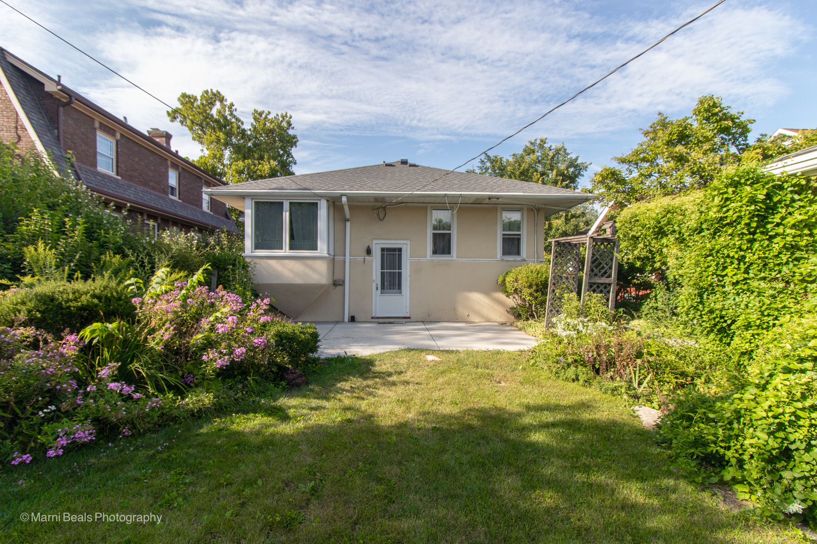 269 Shenstone Road Riverside, IL 60546 - Photo 21 of 25 a view of a house with a big yard and potted plants