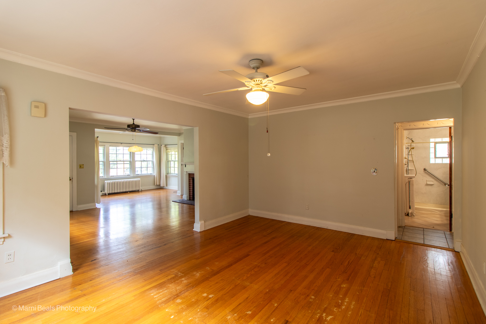 269 Shenstone Road Riverside, IL 60546 - Photo 5 of 25 a view of an empty room with window and wooden floor