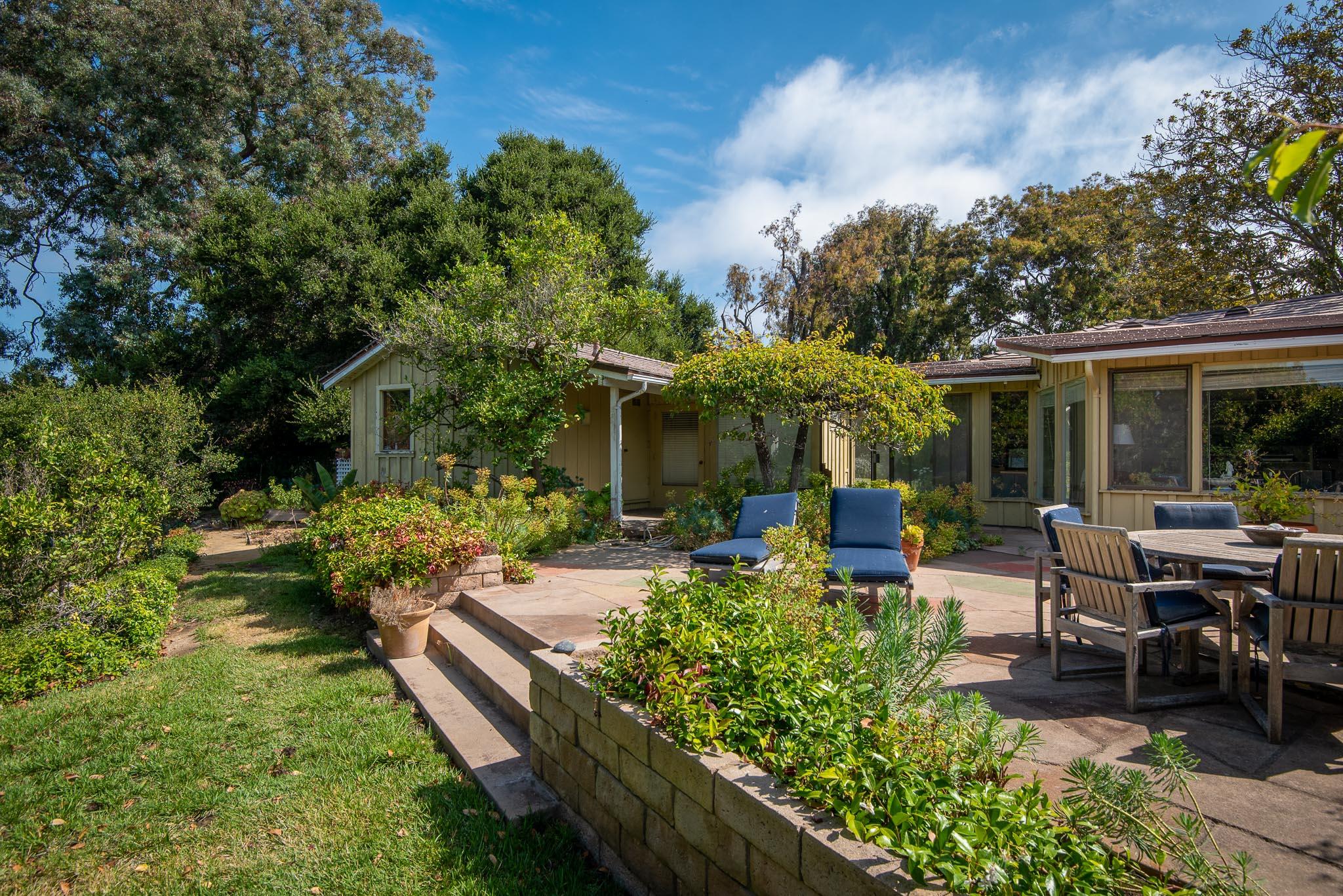 895 Via Hierba Santa Barbara, CA 93110 - Photo 14 of 24 a view of a house with backyard sitting area and garden