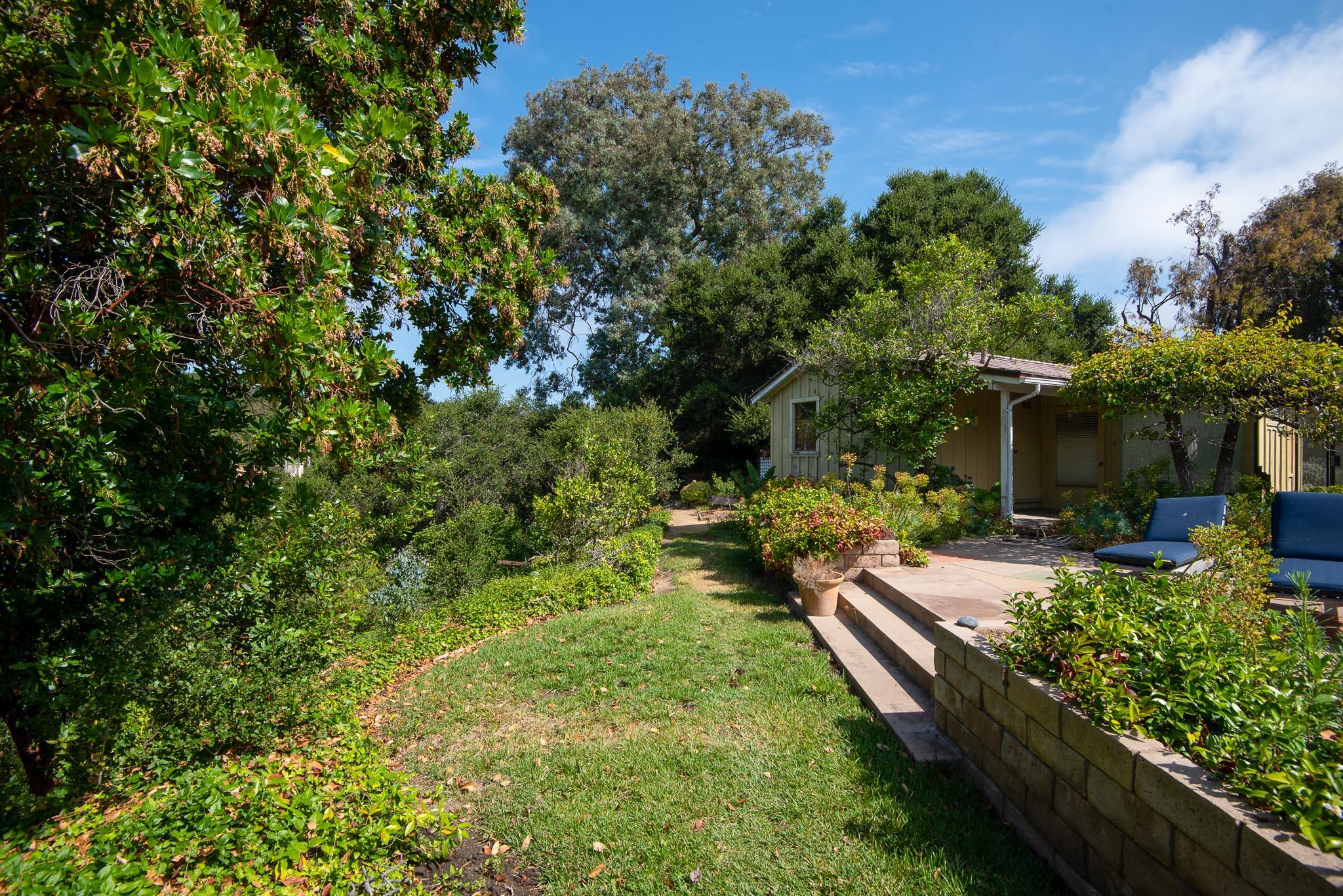895 Via Hierba Santa Barbara, CA 93110 - Photo 15 of 24 a view of a house with backyard sitting area and garden