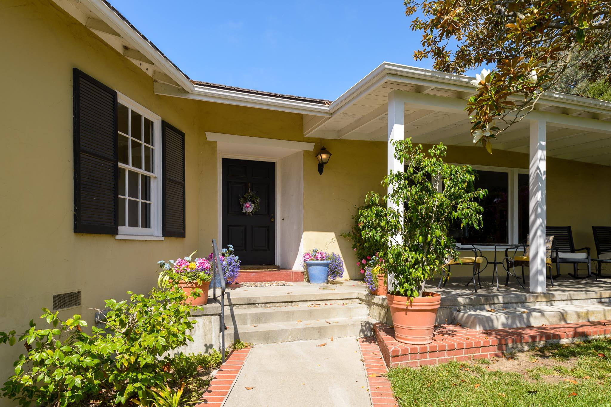 895 Via Hierba Santa Barbara, CA 93110 - Photo 3 of 24 a front view of a house with fountain and garden