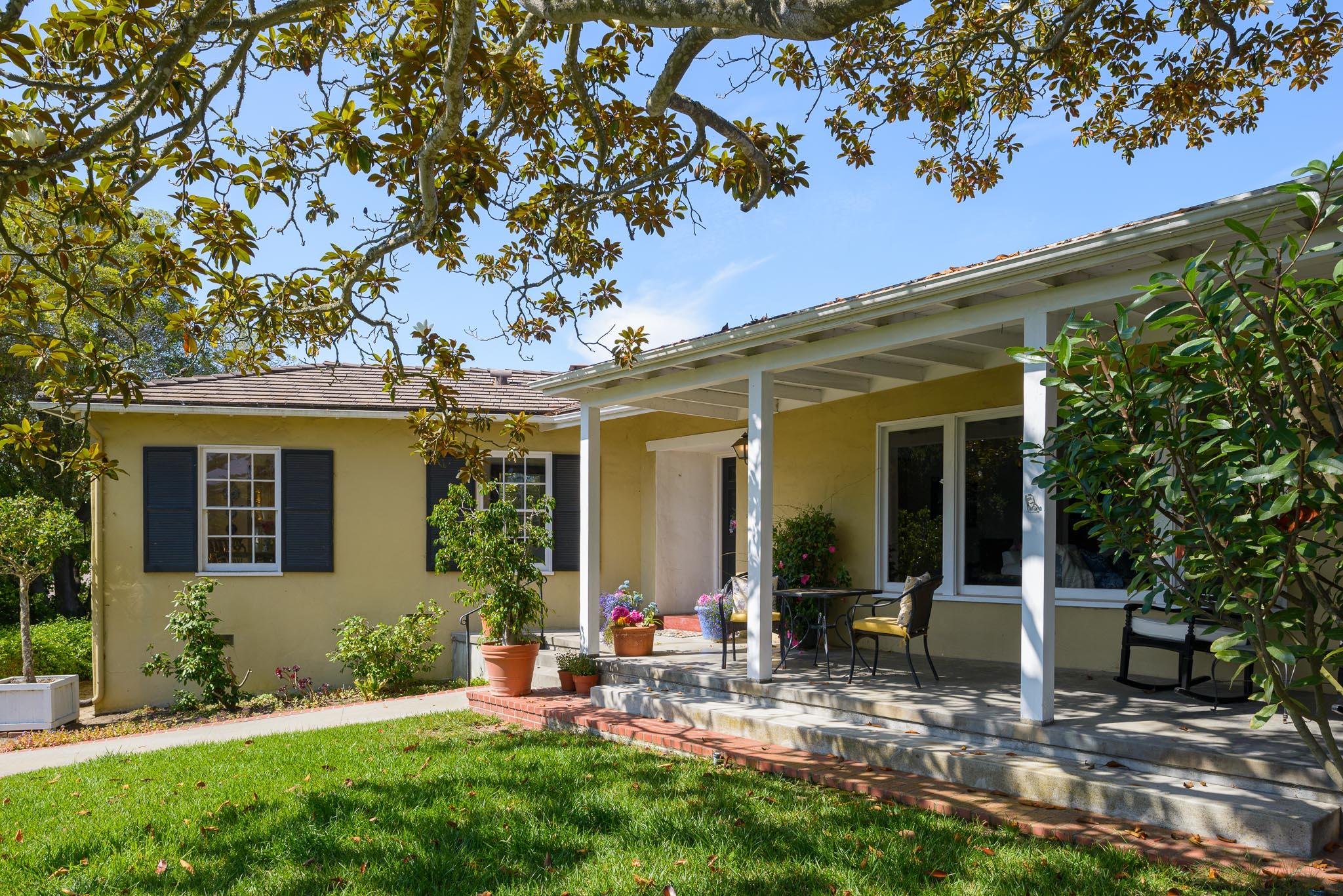 895 Via Hierba Santa Barbara, CA 93110 - Photo 5 of 24 a view of a house with backyard sitting area and garden