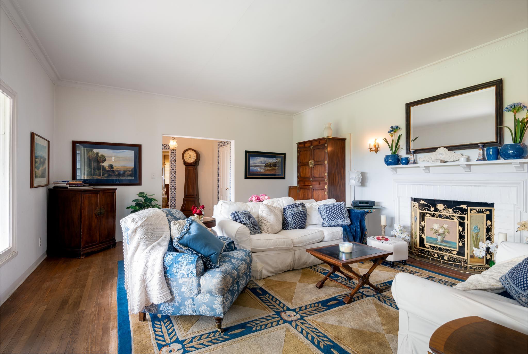895 Via Hierba Santa Barbara, CA 93110 - Photo 6 of 24 a living room with furniture a flat screen tv and a fireplace