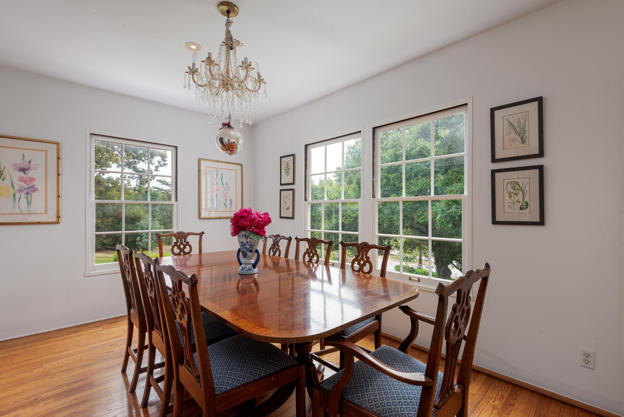 895 Via Hierba Santa Barbara, CA 93110 - Photo 8 of 24 a dining room with furniture a chandelier and wooden floor