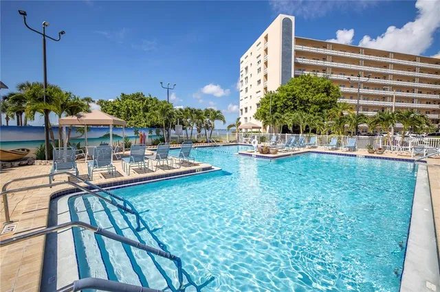 a view of a swimming pool with a patio