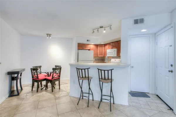 a view of a dining room with furniture