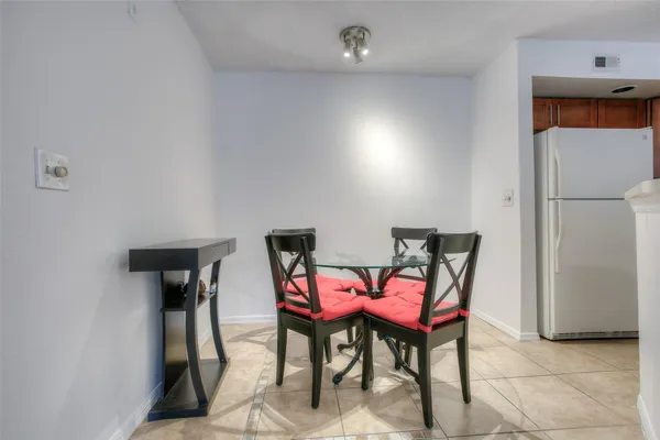 a view of a room with furniture and a table