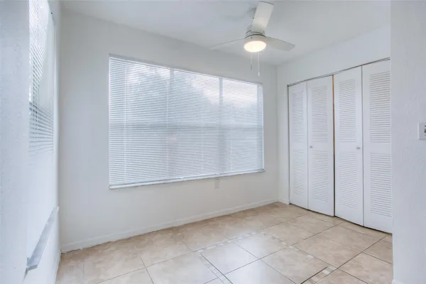 an empty room with a empty space and windows