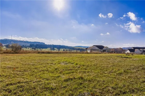a view of an ocean and a mountain
