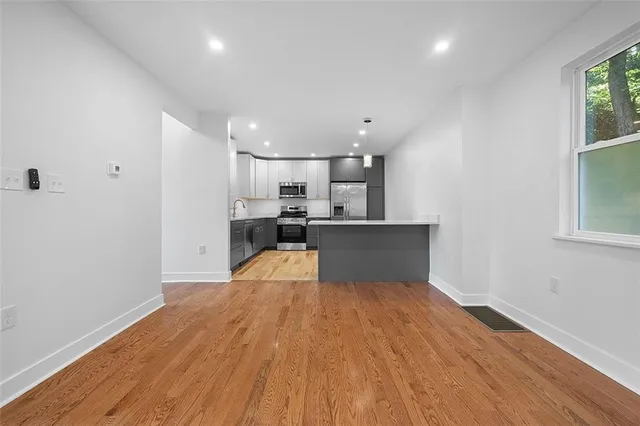 a view of kitchen with wooden floor