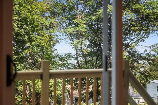 a view of a small yard from a balcony