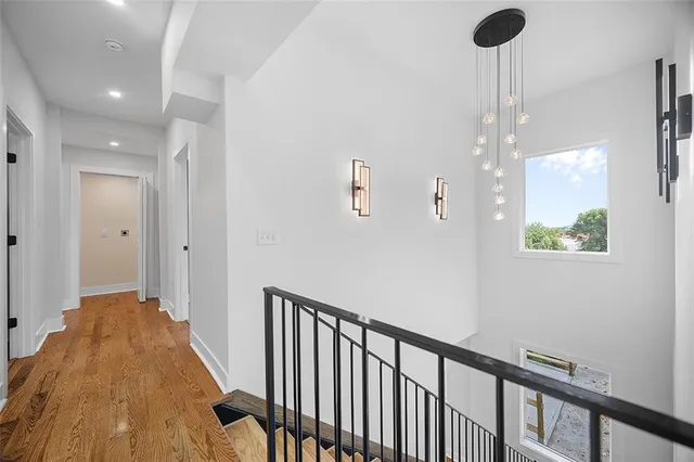 a view of a hallway view with staircase