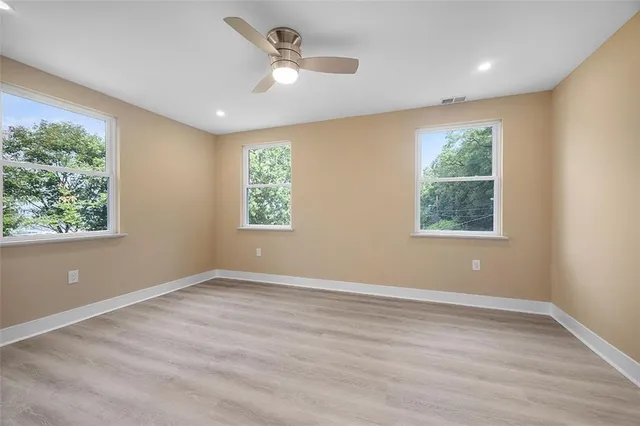 a view of an empty room with a window