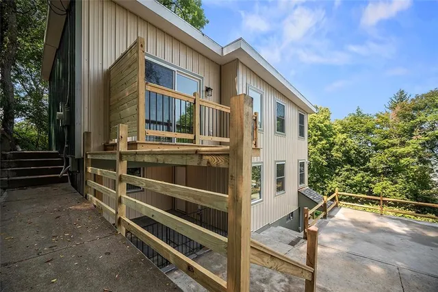a view of an house with backyard and sitting area