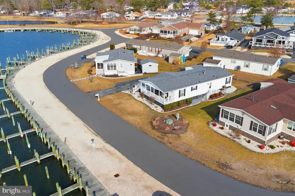 an aerial view of a house with outdoor space swimming pool and ocean view