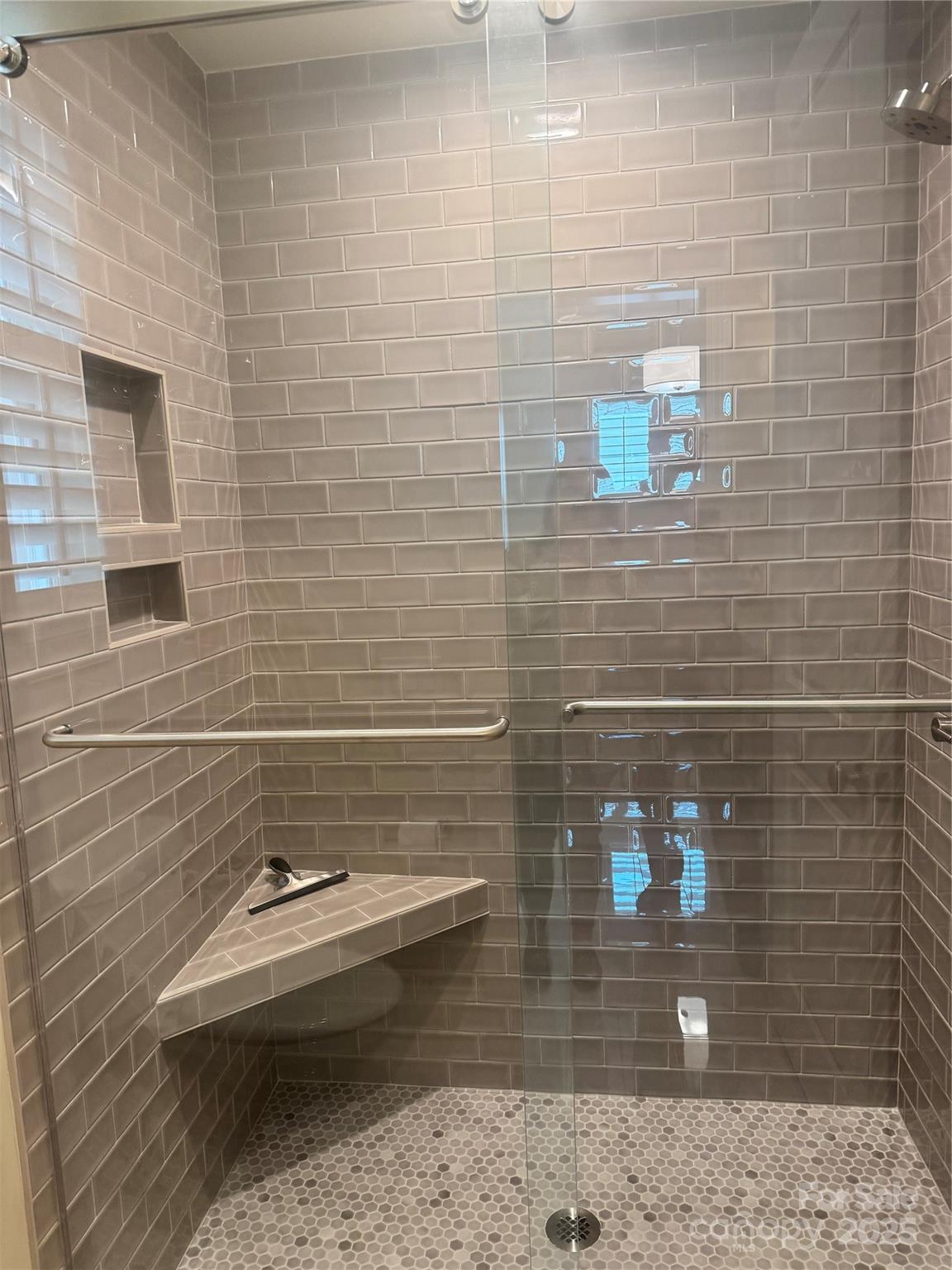 17728 Jetton Green Loop Cornelius, NC 28031 - Photo 3 of 7 a bathroom with a sink and a shower