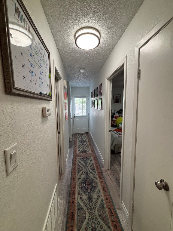 30 Oak Villa Road Canyon Lake, TX 78133 - Photo 11 of 29 a view of a hallway with wooden floor and entryway