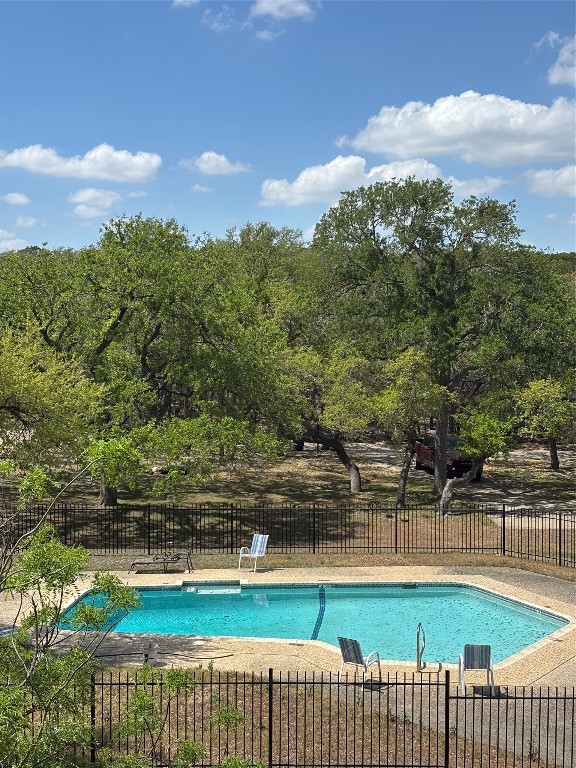 30 Oak Villa Road Canyon Lake, TX 78133 - Photo 27 of 29 a view of a swimming pool with an outdoor seating