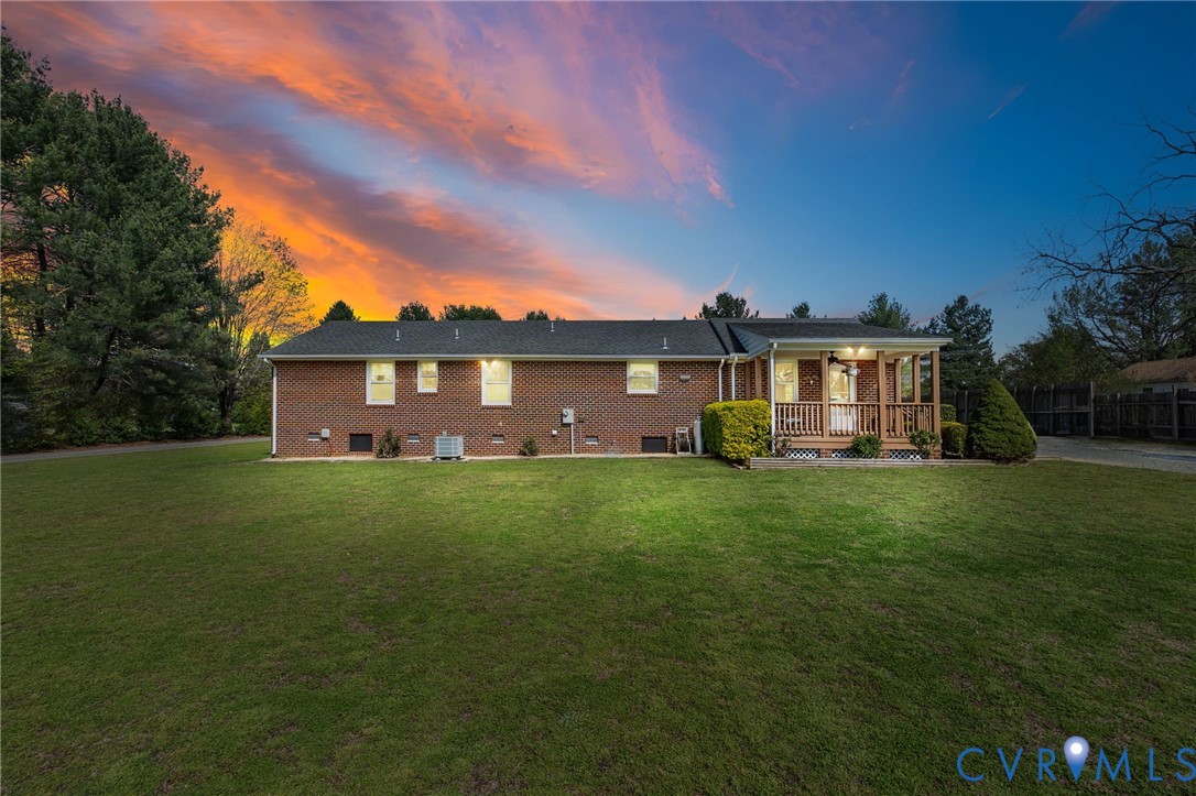 3411 Spring Run Road Mechanicsville, VA 23111 - Photo 36 of 41 a front view of a house with a garden and deck