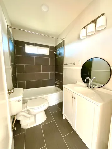 a bathroom with a bathtub and sink