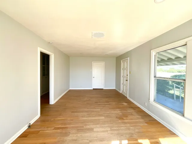a view of an empty room and window