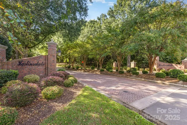 a view of a street with houses on both side