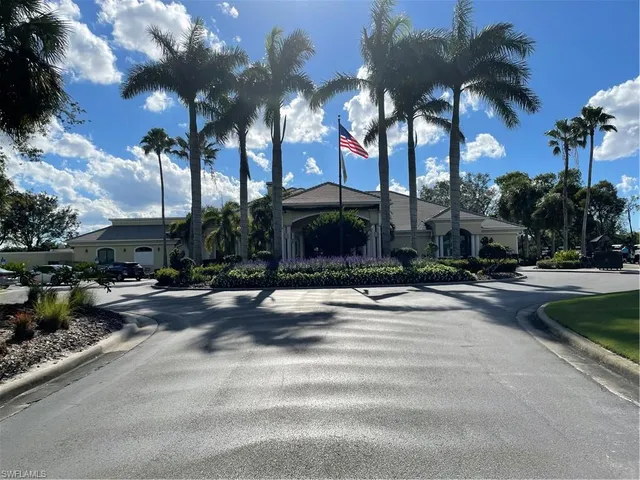 a front view of a house with yard and green space