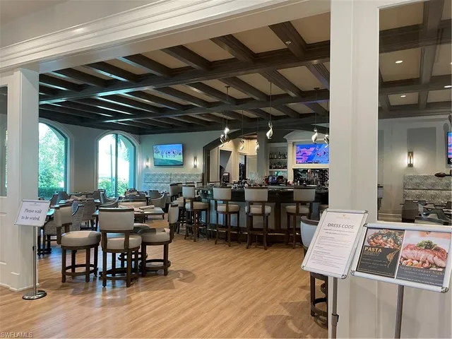 a room with lots of furniture and a wooden floor