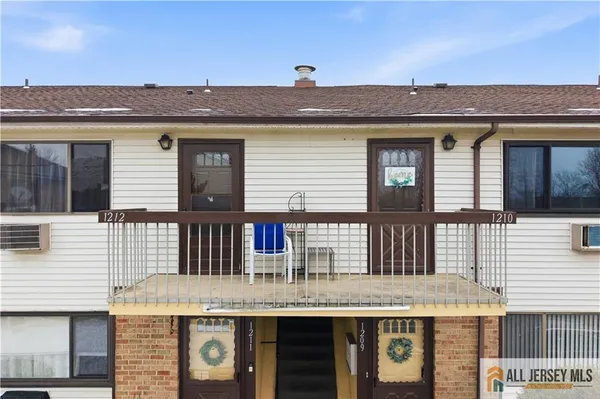 a front view of a house with a balcony
