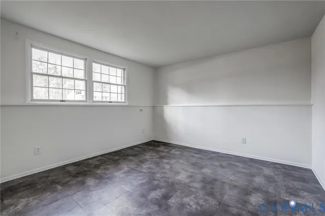 an empty room with a empty space and window