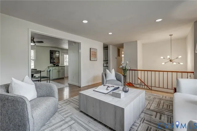 a living room with furniture and a table