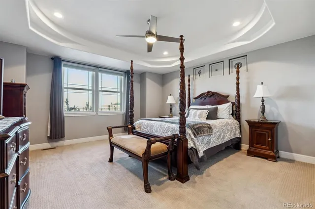 a bedroom with a bed and a flat tv screen