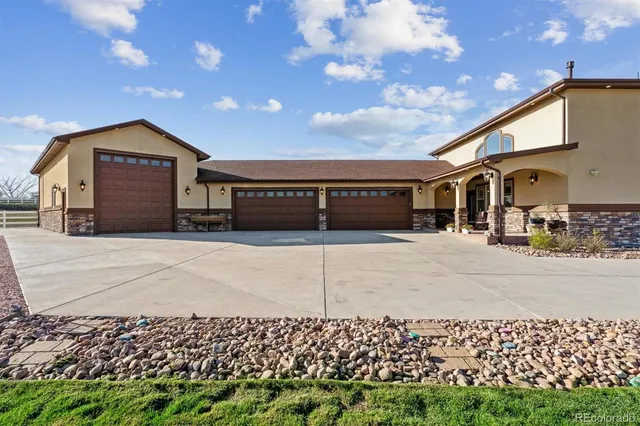 a front view of a house with a garage