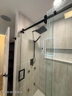 331 Stearman Road Brick, NJ 08723 - Photo 12 of 16 a bathroom with a shower and a glass door