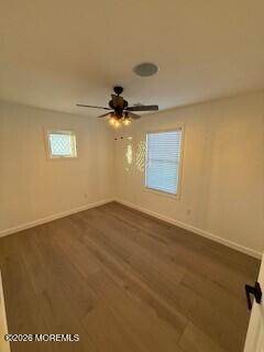 331 Stearman Road Brick, NJ 08723 - Photo 14 of 16 an empty room with a ceiling fan and window